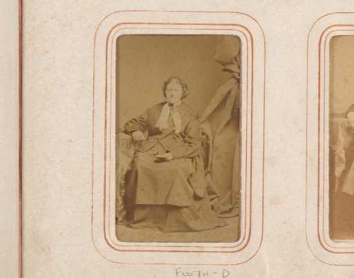 Portrait of an old seated woman with cap and book