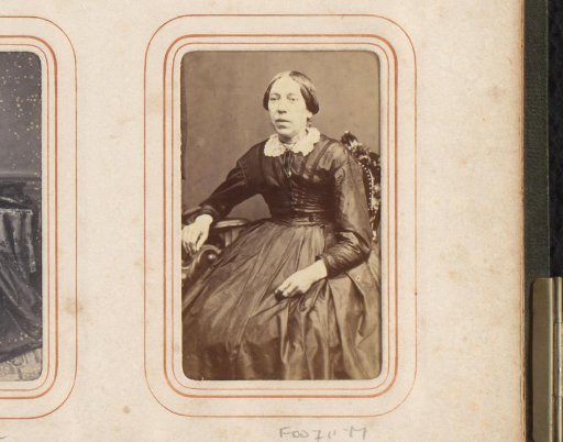 Portrait of an old seated woman