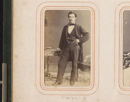 Portrait of a Young Man, Standing by a Chair and Table with Books