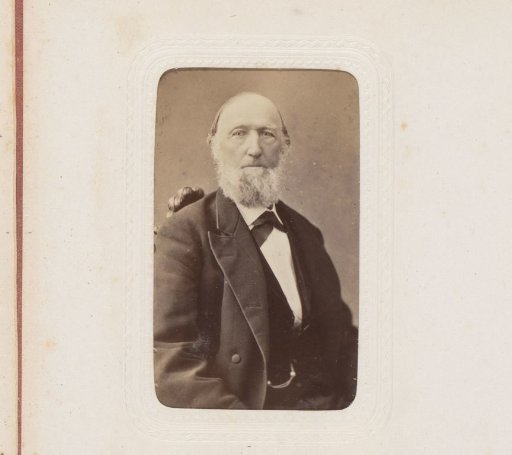 Portrait of a seated man with a beard
