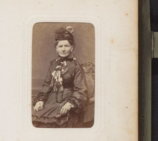 Portrait of a seated woman with a hat