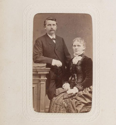 Portrait of a seated woman and a standing man leaning on a balustrade