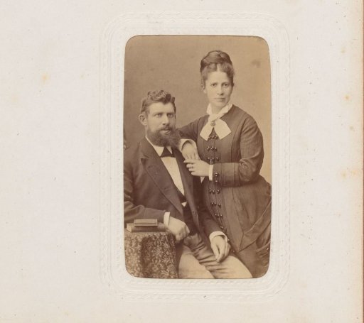 Portrait of a seated man and a standing woman