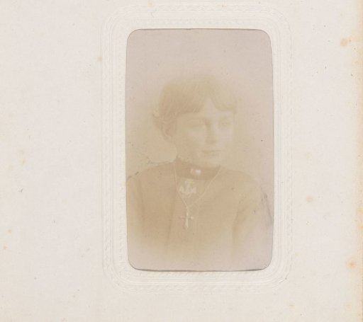 Portrait of a girl with a necklace featuring a cross