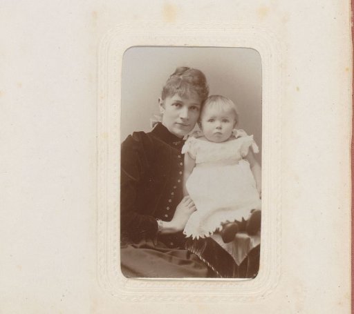 Portrait of a woman with a girl on her lap