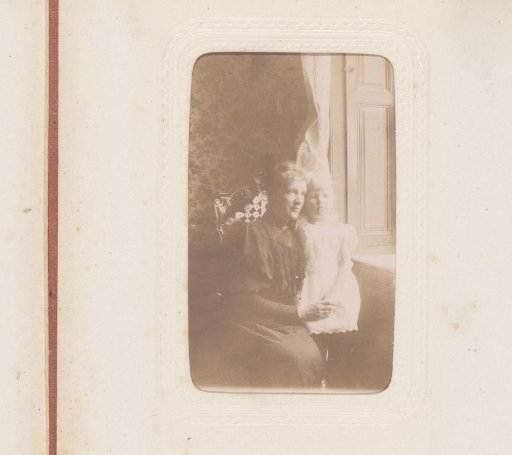 Portrait of a seated woman and a girl by a windowsill