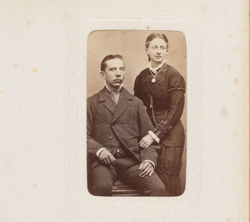 Portrait of a standing woman and a seated man