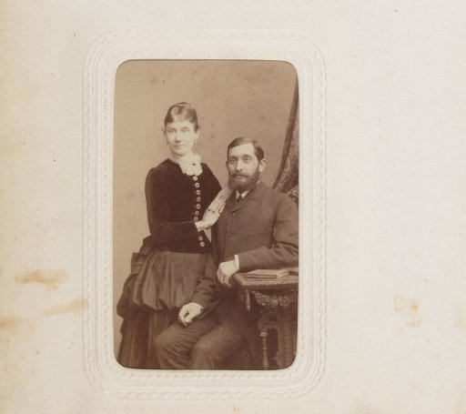 Portrait of a standing woman and a seated man