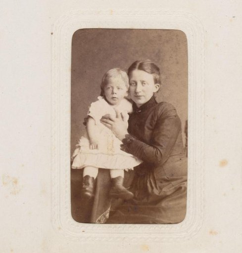 Portrait of a seated woman and a baby