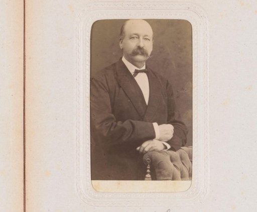 Portrait of a man by a chair, inscribed as Van Brakel