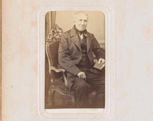 Portrait of a seated man with a book in his hand, identified as J. Swets