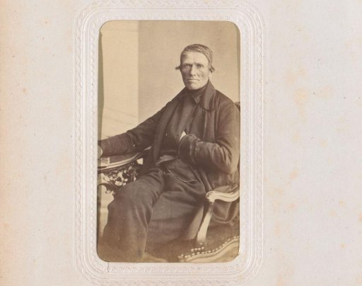 Portrait of a seated man with a hand in his jacket, identified as Vermeulen