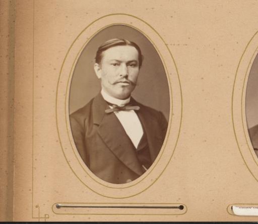 Portrait of a man with a mustache and bow tie