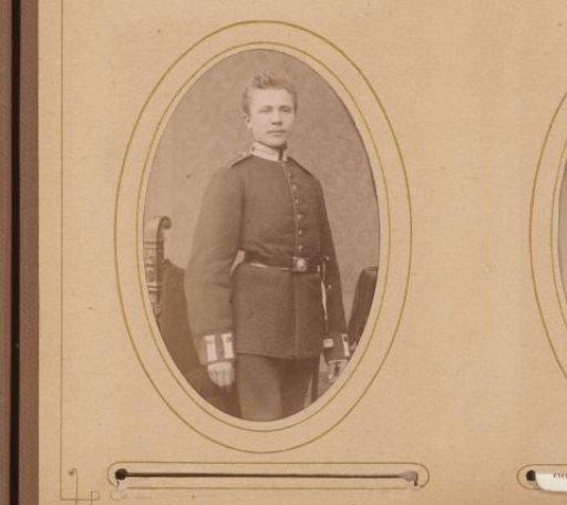 Portrait of a Standing Young Man in Uniform