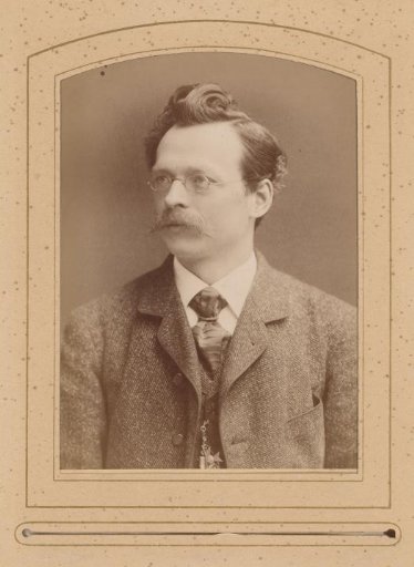 Portrait of a man with a mustache and glasses