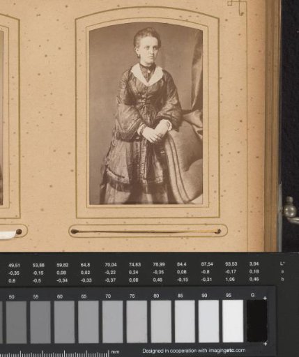 Portrait of a standing woman beside a chair, identified as Thekla Bonitz