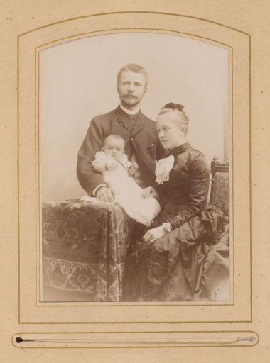 Family Portrait of a Standing Man, a Seated Woman, and a Baby