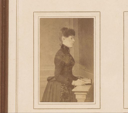 Portrait of a standing woman with a book