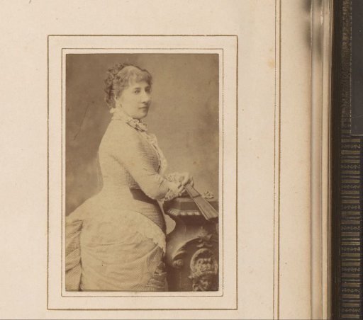 Portrait of a standing woman with a fan