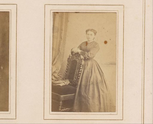 Portrait of a Standing Woman by a Chair
