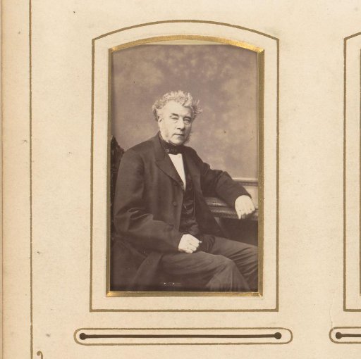 Portrait of a man seated at a table