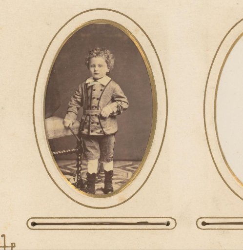 Portrait of a Boy Standing by a Chair and a Drum