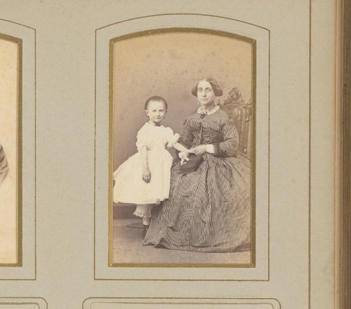 Portrait of a seated woman and a standing girl