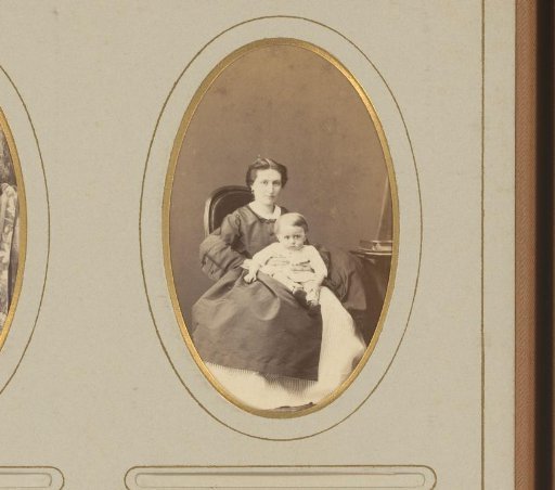 Portrait of a seated woman with a baby on her lap