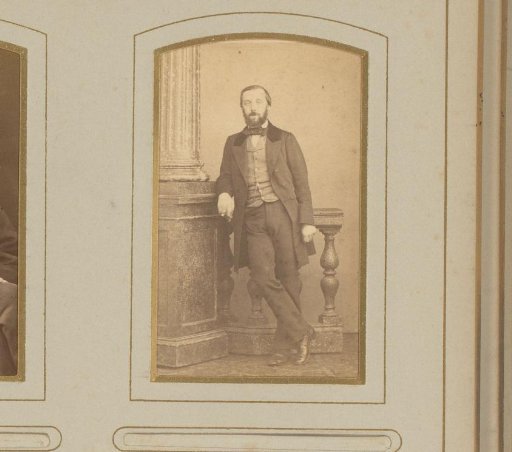 Portrait of a man leaning on a balustrade