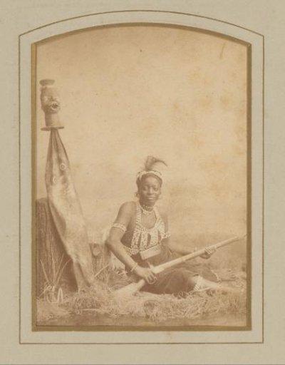 Portrait of a seated woman holding a musket