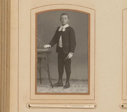 Portrait of a Standing Boy with a Book