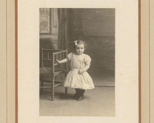 Portrait of a Standing Girl by a Chair