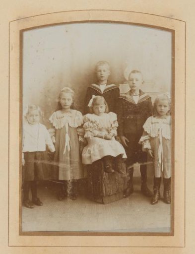 Group portrait with six children, two boys and four girls