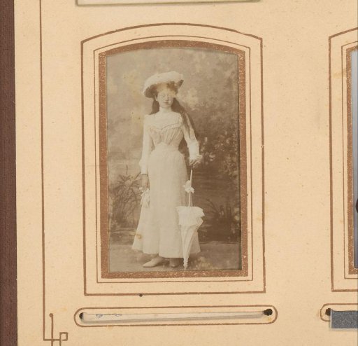 Portrait of a Young Woman in a White Dress with a Hat and Umbrella
