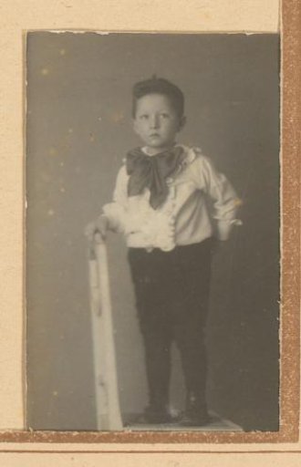 Portrait of a boy with a bow