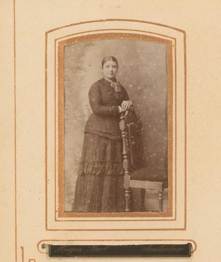 Portrait of a standing woman by a chair