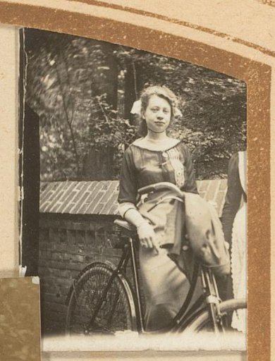 Portrait of a young woman with a bicycle