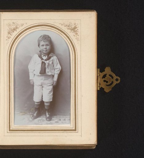 Portrait of a standing boy in a sailor suit