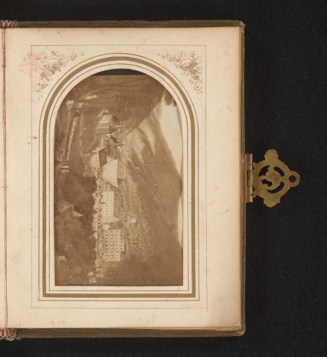 Photographic reproduction of a painting of a landscape with a hotel and walkers in a valley