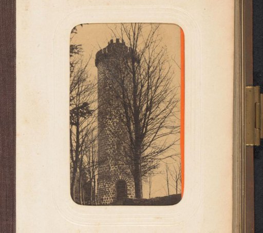 Tower with battlements and trees around it