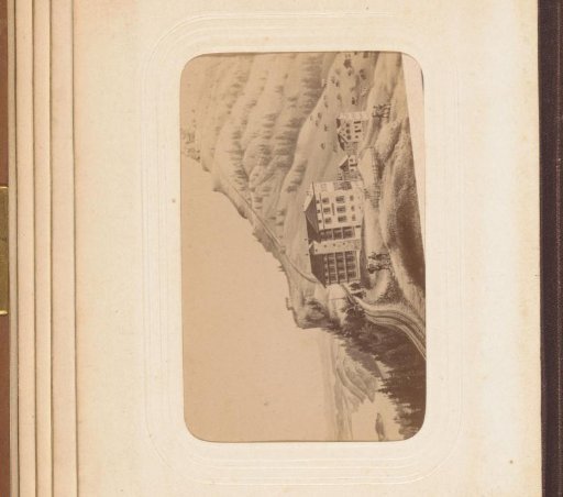 Photographic reproduction of a drawing of a mountain hotel with train