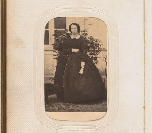 Portrait of a woman with a fan in her hand