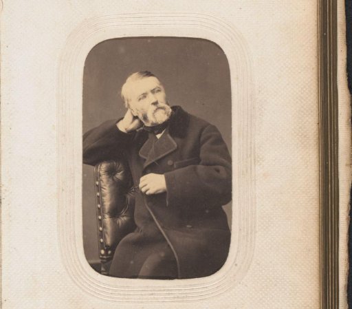 Portrait of a seated man with a beard