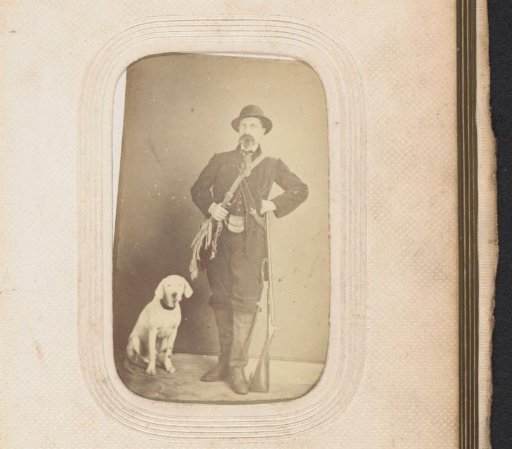 Portrait of a man in hunting costume with a dog, rifle, shoulder bags and drinking flask