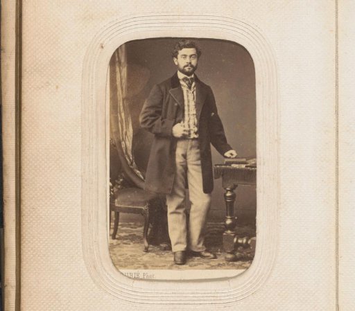 Portrait of a standing man with a book