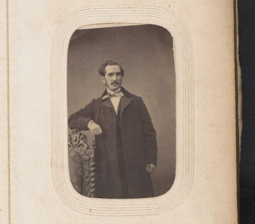 Portrait of a standing man with a moustache