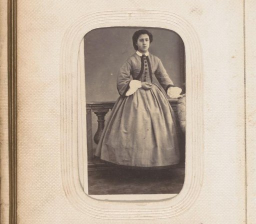 Portrait of a standing girl by a balustrade