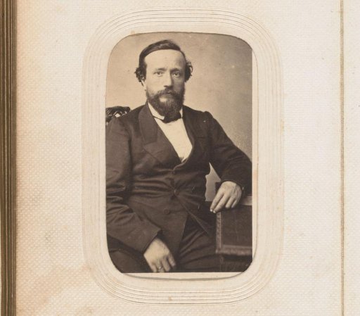 Portrait of a sitting man with a beard