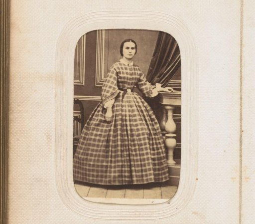 Portrait of a standing young woman by a balustrade