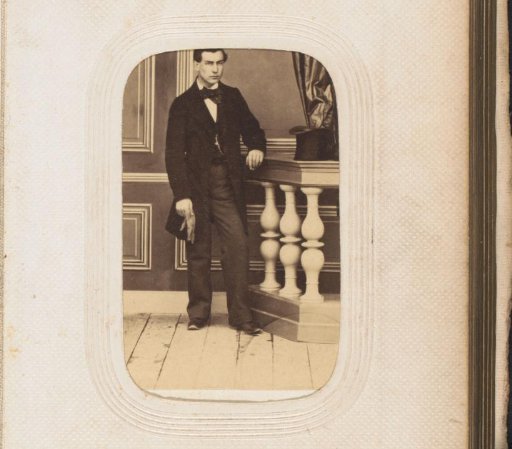 Portrait of a standing young man by a balustrade